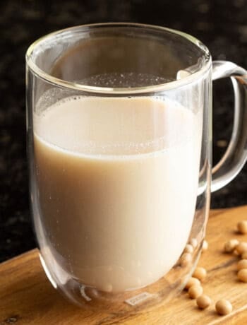 Close up shot of a glass of freshly made soy milk.