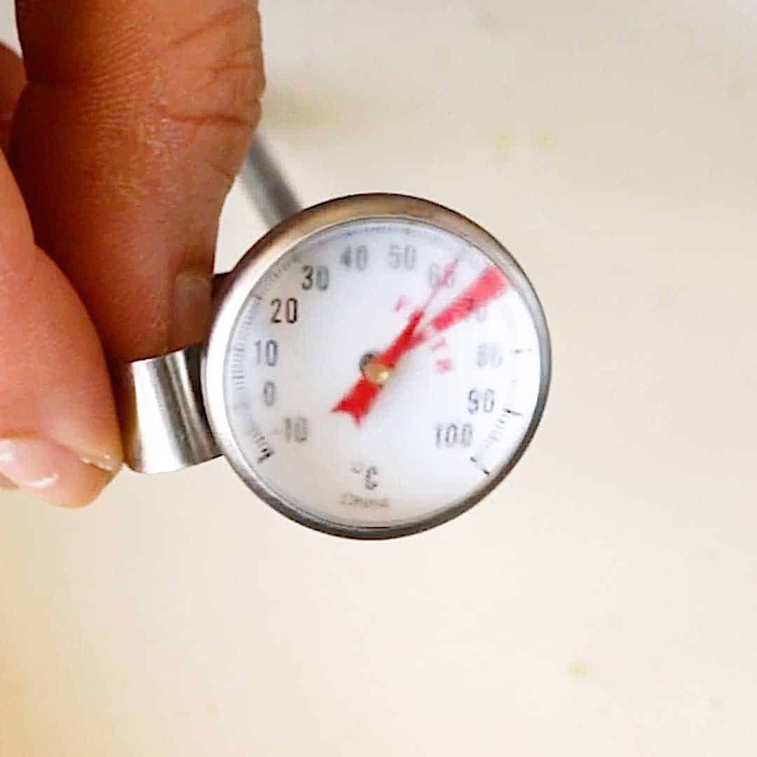A milk thermometer showing frothing temperature.