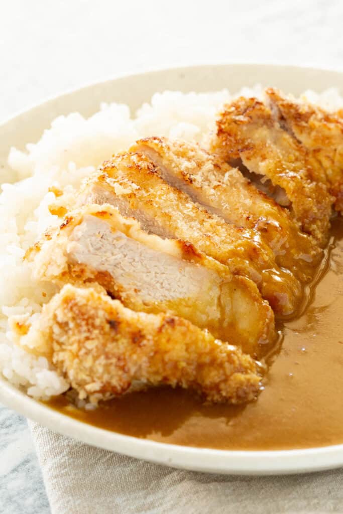 Katsu curry in a large white bowl, ready to eat.