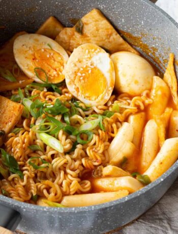 Rabokki topped with boiled eggs and spring onion.