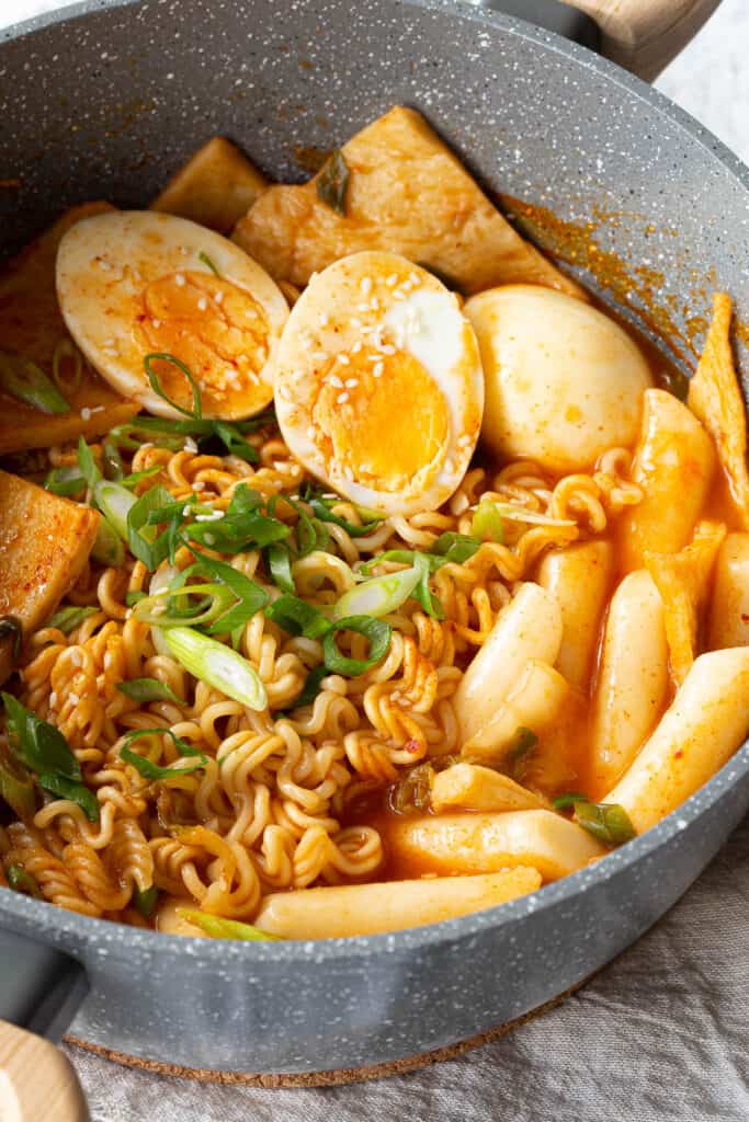 Rabokki topped with boiled eggs and spring onion.