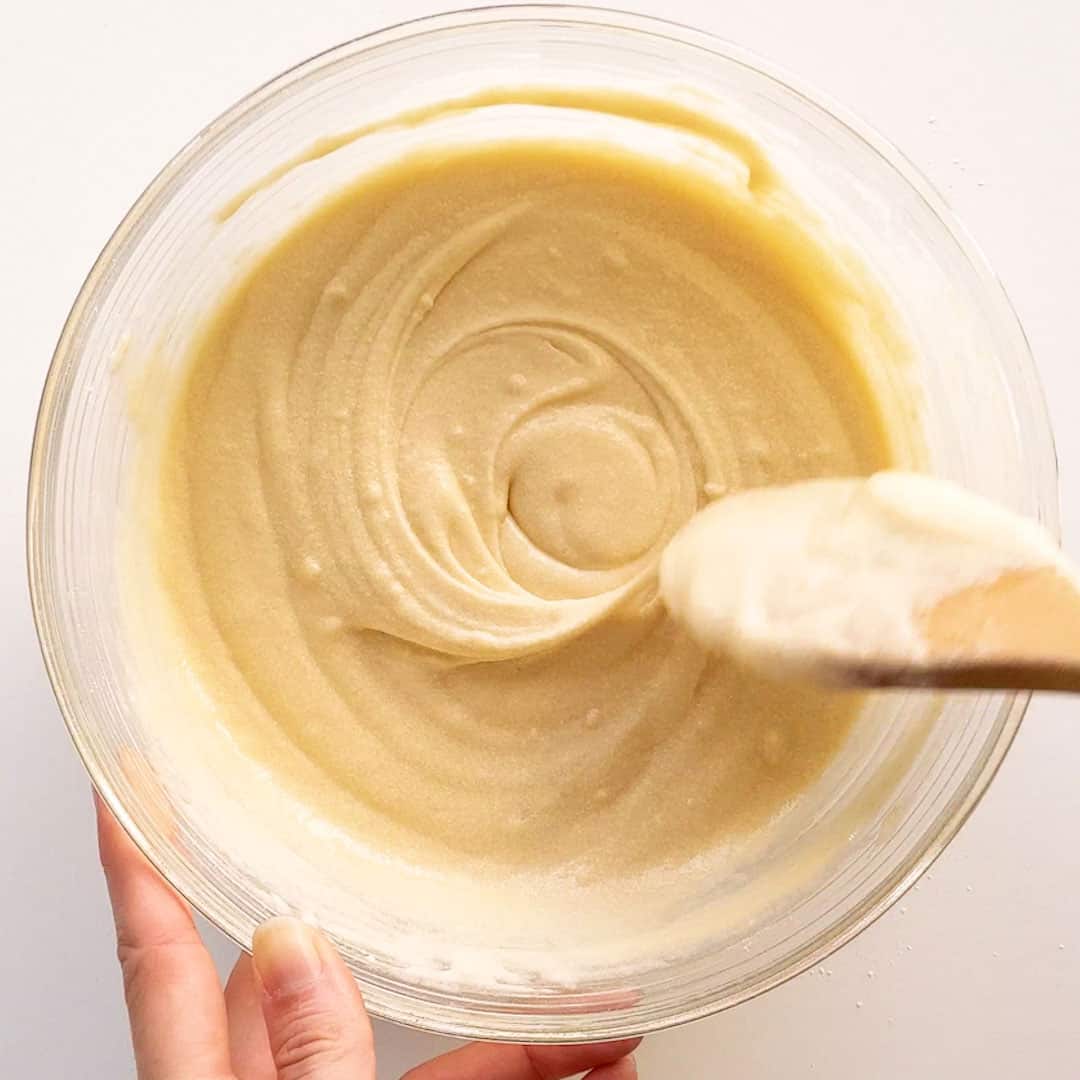 Mixing the cake batter until smooth.