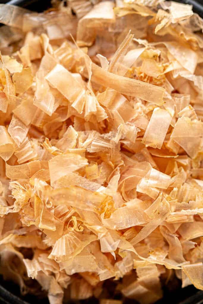 Close up shot of a pile of katsuobushi flakes showing the texture.