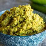 Bowl of bright Thai green curry paste, freshly made.