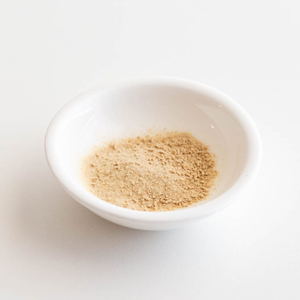 Small white dish filled with dashi powder.