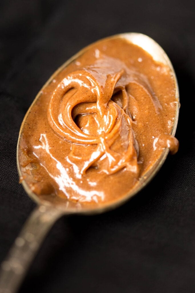 Speculoos spread on a spoon.