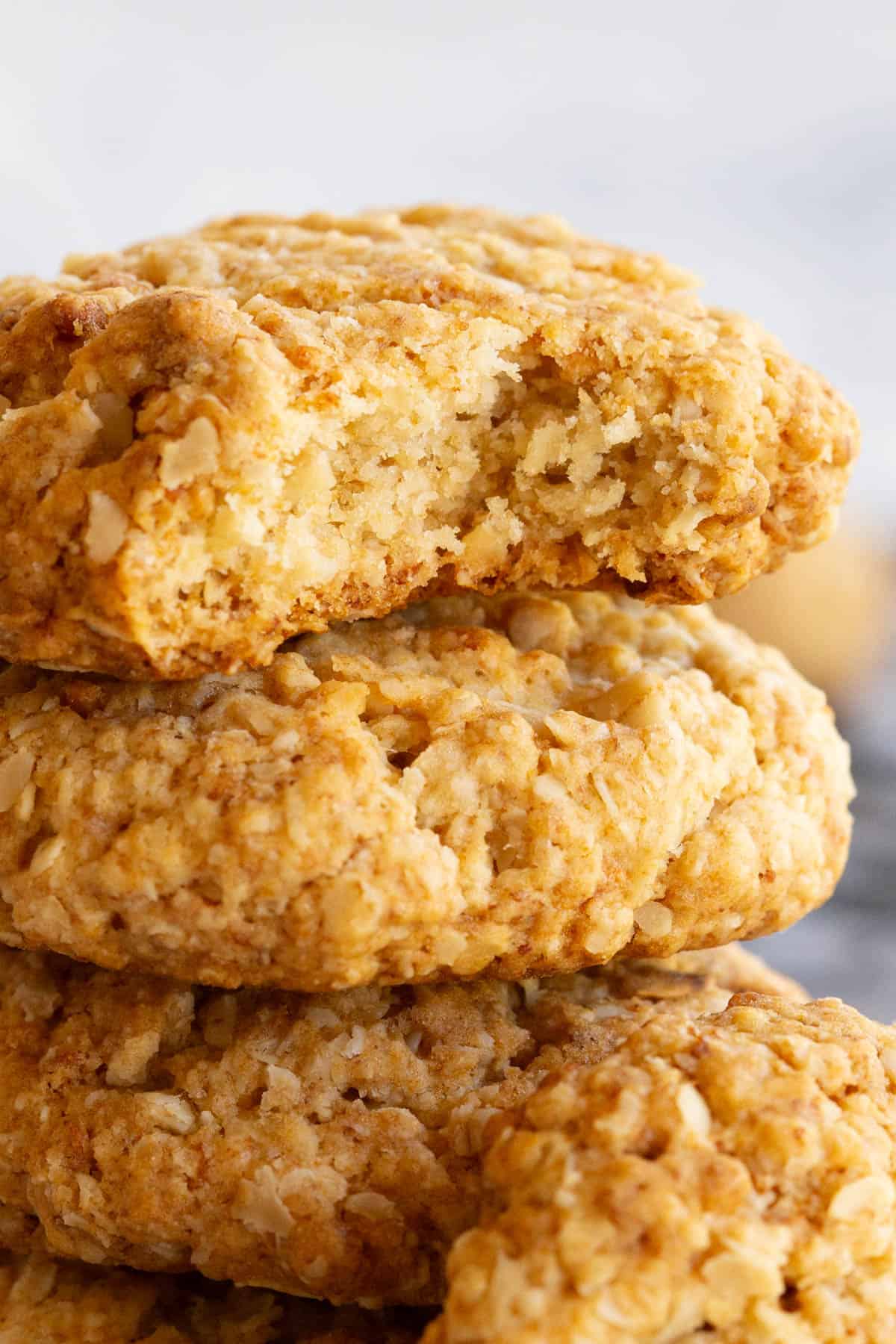 Close up shot of a stack of golden oat biscuits.