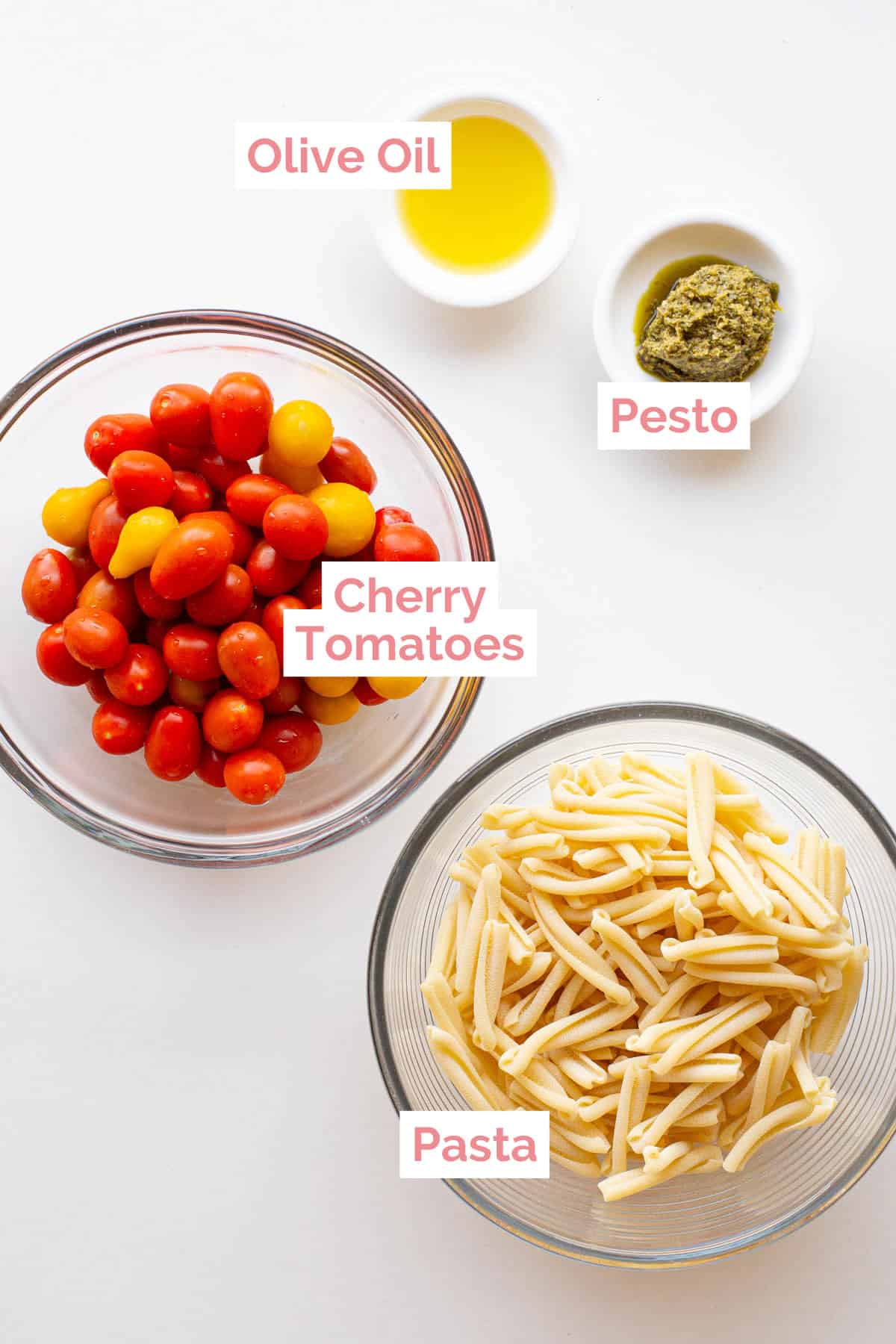 Ingredients laid out ready to make cherry tomato pesto pasta.