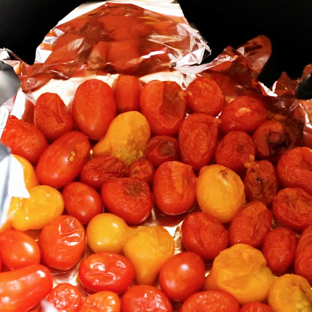Roasting cherry tomatoes in an air fryer.