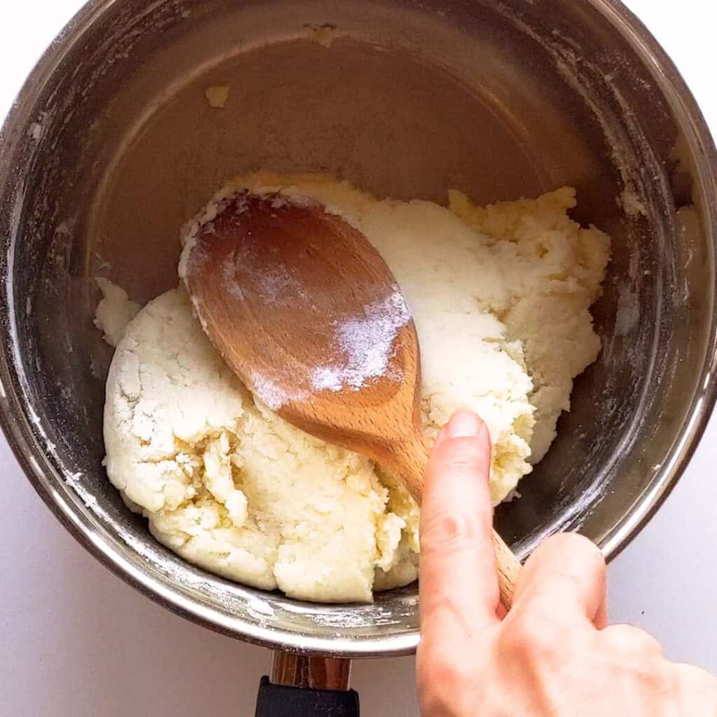 Making the potato scone dough and showing it doesn't stick to the spoon.